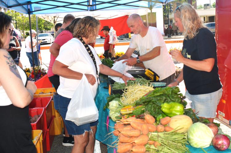 Tony Jay of Monroe sells produce at the downtown Beloit Farmers Market on Saturday. Jay, like other produce growers at the market, said this year’s dry conditions has been a challenge for produce vendors.
