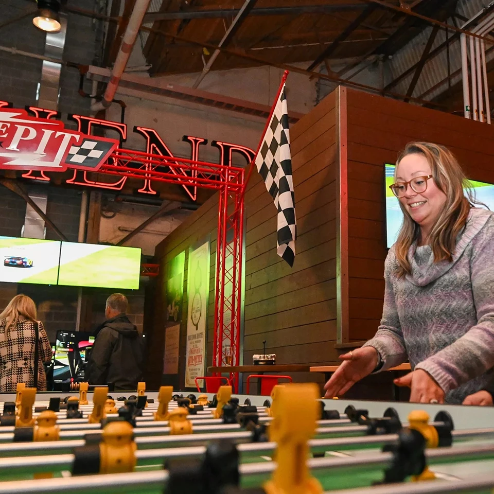 Women playing foosball 